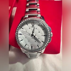 Jennifer Lopez silver watch with diamond accents.